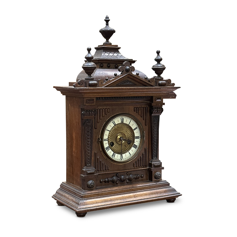Walnut mantle clock with decorative accents